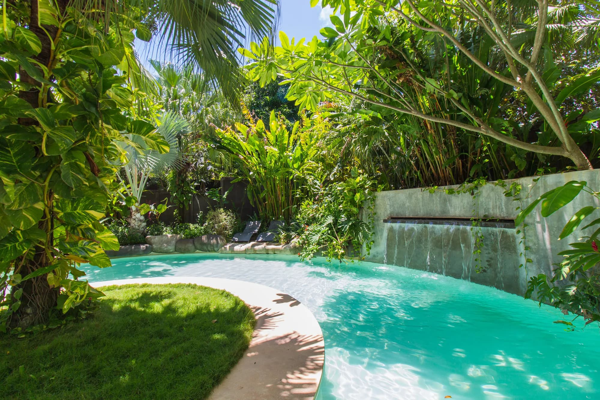 Villa Don Vito — the pool wrapped in tropical garden